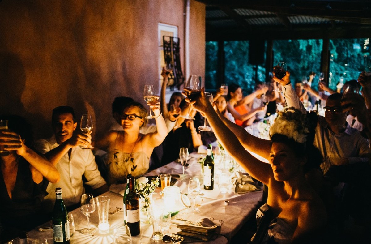 Wedding speeches at Redleaf Wollombi — Joshua Mikhaiel, documentary wedding photographer Guests speak and sing at the reception in a two-photo collage. Photograph by documentary wedding photographer Joshua Mikhaiel.