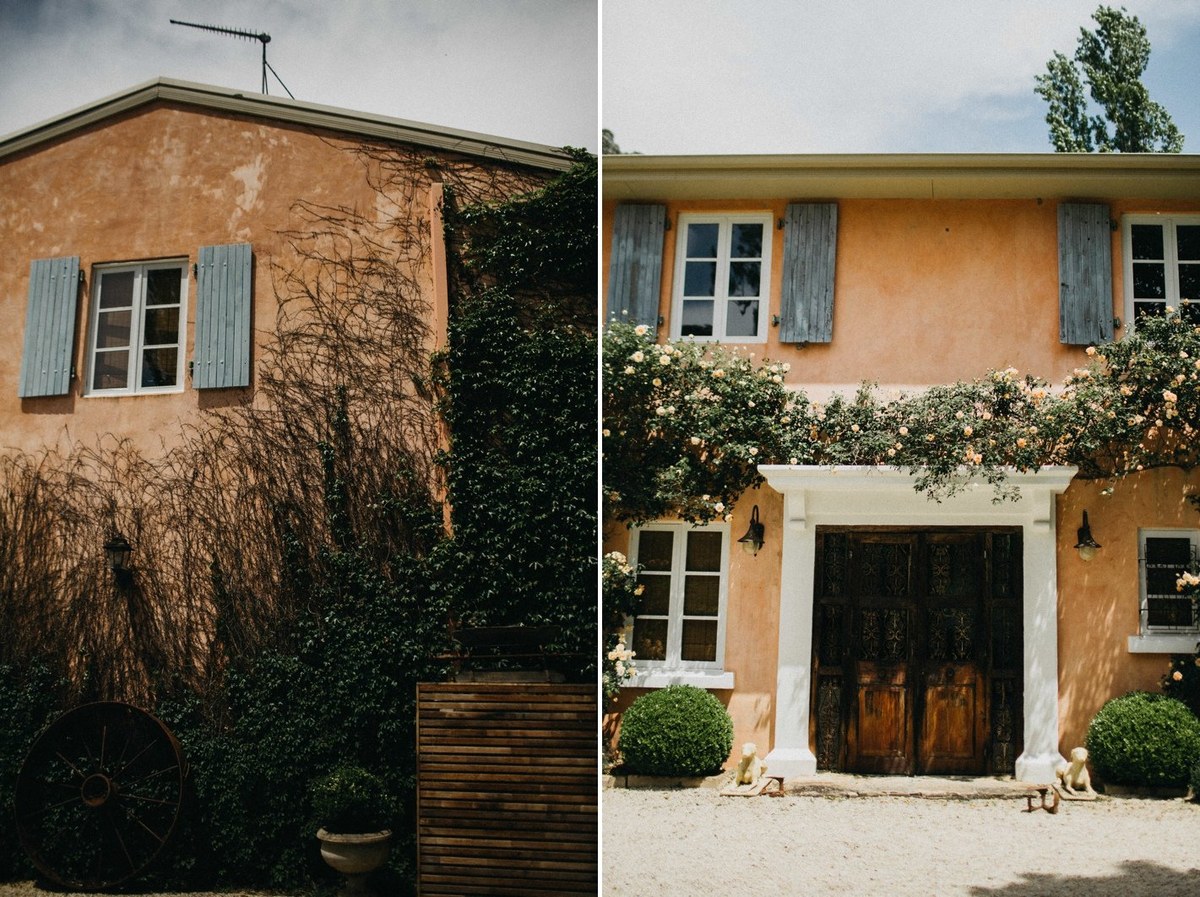 Redleaf Wollombi homestead — Joshua Mikhaiel, documentary wedding photographer A country homestead stands amid trees and flowering shrubs. Photograph by documentary wedding photographer Joshua Mikhaiel.