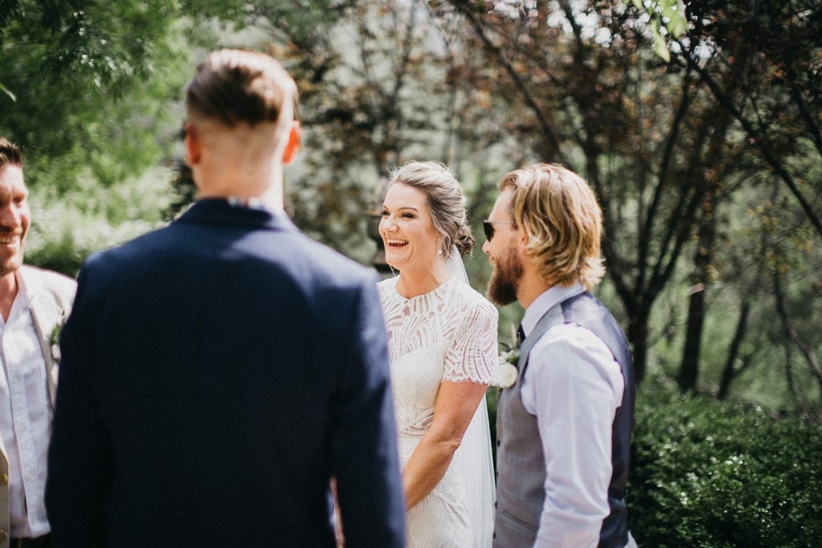 Wedding guests at Redleaf Wollombi — Joshua Mikhaiel, documentary wedding photographer The bride and groom greet a guest after the ceremony. Photograph by documentary wedding photographer Joshua Mikhaiel.