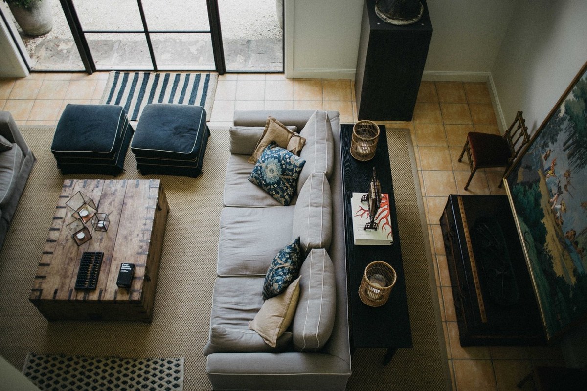 Redleaf Wollombi sitting room — Joshua Mikhaiel, documentary wedding photographer A living room is viewed from above, with sofas arranged around a low table. Photograph by documentary wedding photographer Joshua Mikhaiel.