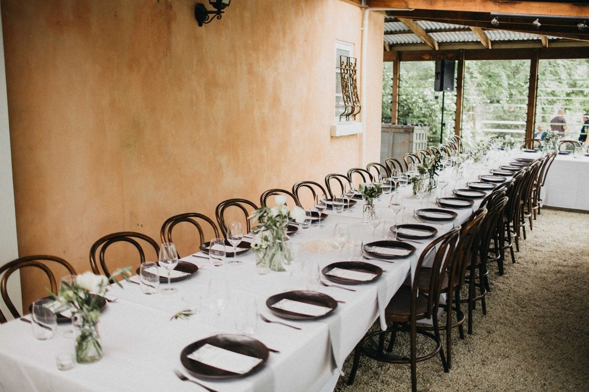 Reception at Redleaf Wollombi — Joshua Mikhaiel, documentary wedding photographer Long reception tables are arranged in the homestead dining room. Photograph by documentary wedding photographer Joshua Mikhaiel.