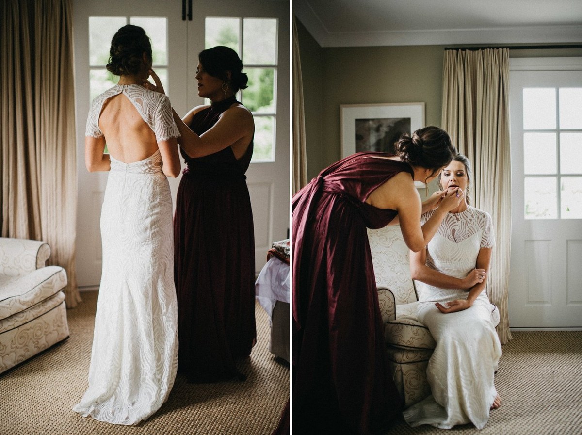 Bridal preparations at Redleaf Wollombi — Joshua Mikhaiel, documentary wedding photographer The bride stands as an attendant adjusts the back of her dress. Photograph by documentary wedding photographer Joshua Mikhaiel.