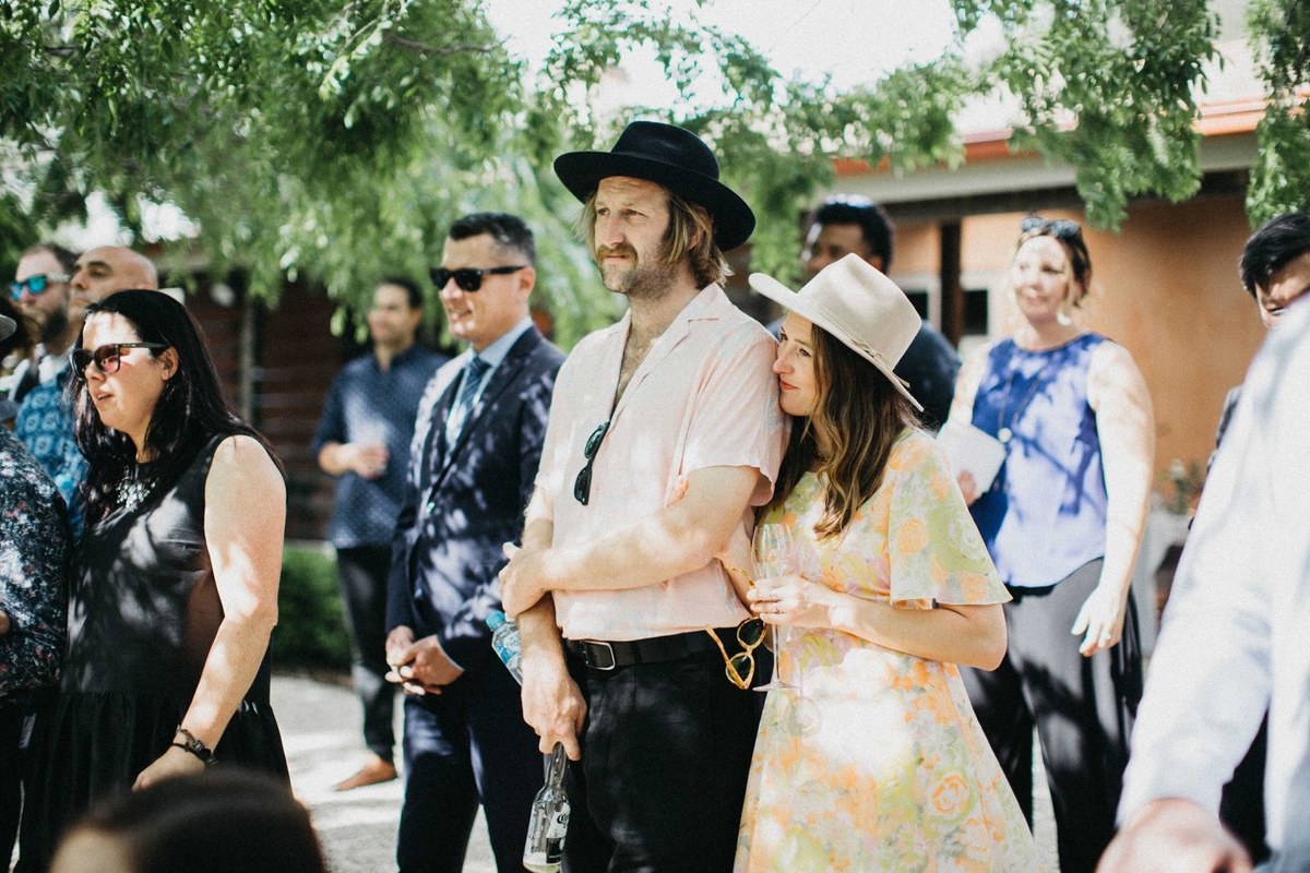 Wedding guests at Redleaf Wollombi — Joshua Mikhaiel, documentary wedding photographer Guests watch the ceremony from beneath the trees. Photograph by documentary wedding photographer Joshua Mikhaiel.