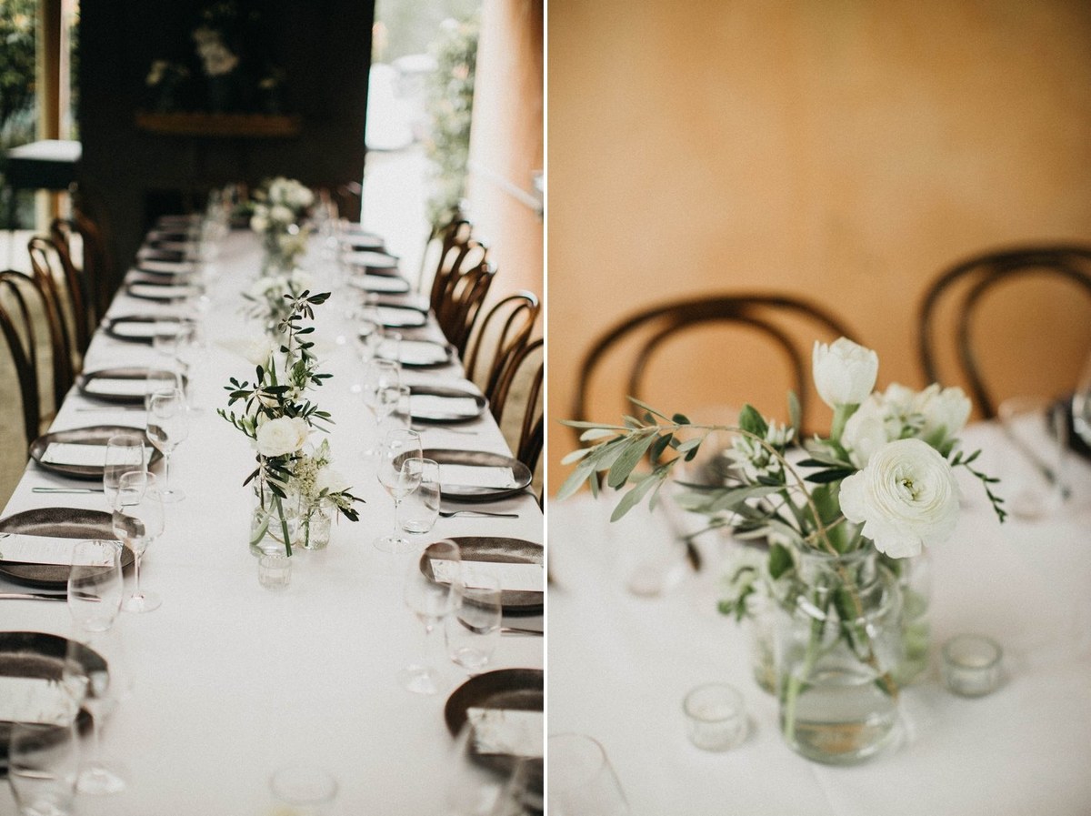 Reception table at Redleaf Wollombi — Joshua Mikhaiel, documentary wedding photographer A long table is set with floral centerpieces and place settings. Photograph by documentary wedding photographer Joshua Mikhaiel.