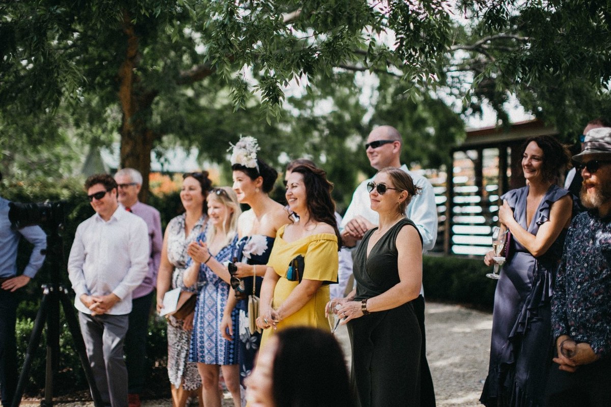 Guests at the Redleaf ceremony — Joshua Mikhaiel, documentary wedding photographer Guests sit in rows beneath the garden trees. Photograph by documentary wedding photographer Joshua Mikhaiel.