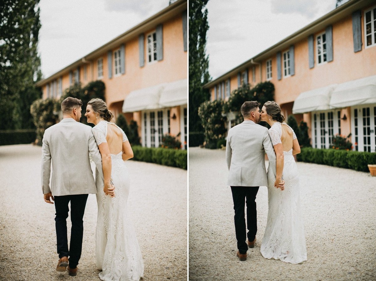 Newlyweds at Redleaf Wollombi — Joshua Mikhaiel, documentary wedding photographer The bride and groom walk together in front of the homestead. Photograph by documentary wedding photographer Joshua Mikhaiel.