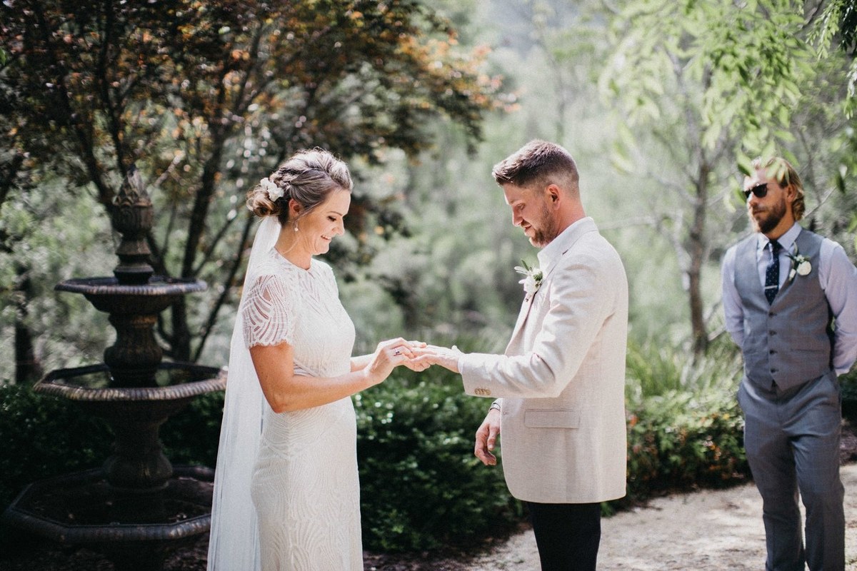 Wedding ceremony at Redleaf Wollombi — Joshua Mikhaiel, documentary wedding photographer Guests watch as the couple share a moment during the ceremony. Photograph by documentary wedding photographer Joshua Mikhaiel.